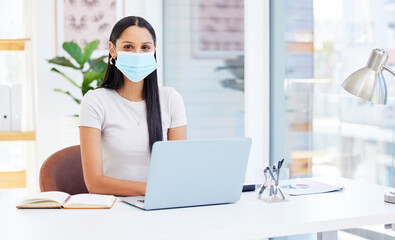 Aufkleber - Working in a safe space. Shot of a young businesswoman using her laptop at work.