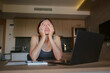 © YURII Seleznov - Frustrated sad woman feeling tired, worried about problem sitting at laptop, depressed girl worried about reading bad news online, debt notification email or negative message
