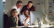 © Yuri A/peopleimages.com - This team is number one. Cropped shot of a group of businesspeople working together on a computer in their office.