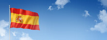 Spanish Flag Isolated On A Blue Sky. Horizontal Banner