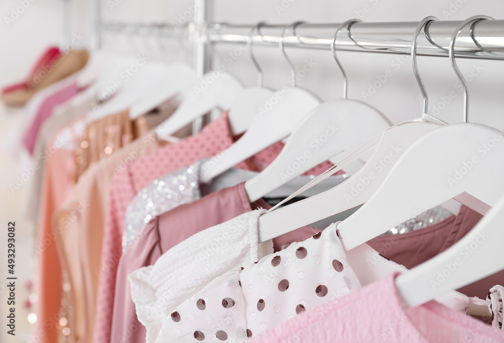 Beautiful dresses for high school prom in shop, closeup