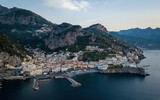 Fototapeta Tulipany - Small seaside town on a sunrise (aerial drone photo). Mediterranean, Amalfi, Italy