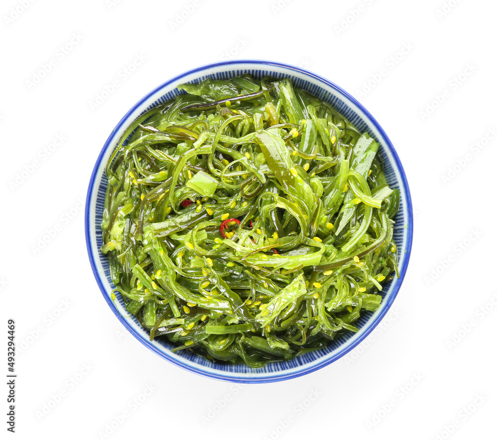Bowl with healthy seaweed salad on white background