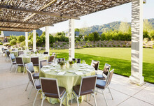 Outdoor Wedding Reception Set Up At A Resort By Lawn