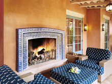 Spanish Tiled Fireplace And Lounge At Luxury Resort