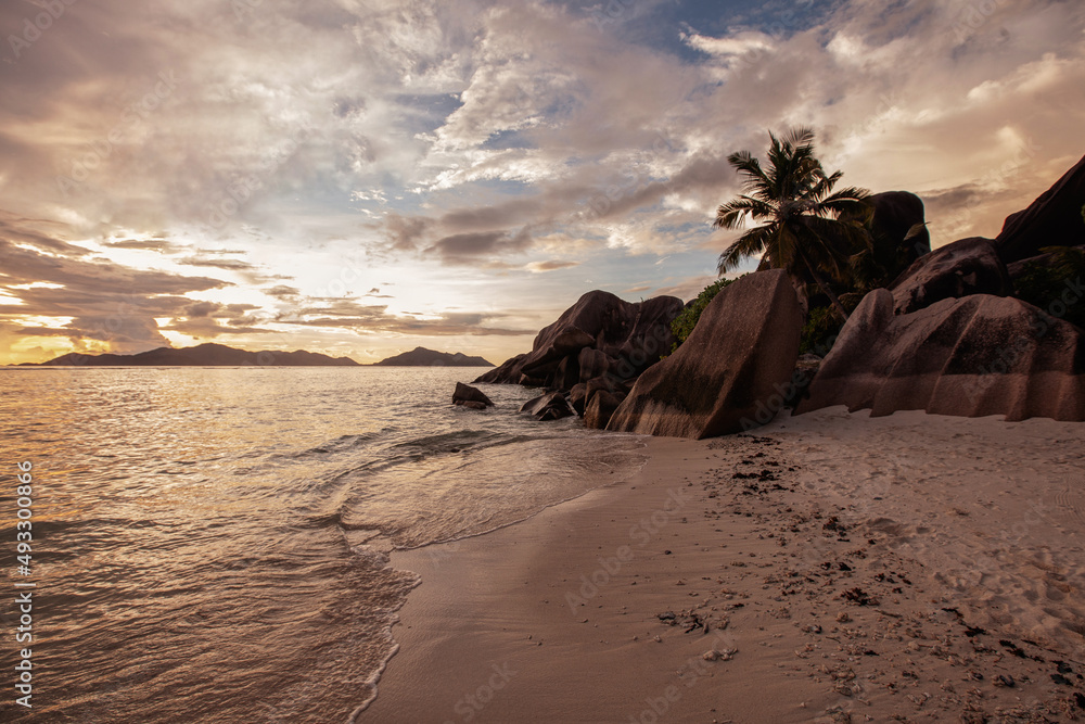 sunset on paradise tropical beach in Seychelles Stock Photo