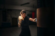 © Studio Marmellata/Stocksy - Focused strong woman boxing in gloves