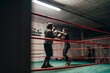 © Studio Marmellata/Stocksy - Determined boxers training in ring