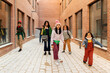© Valentina Barreto/Stocksy - kids in winter clothes outside building portrait