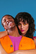 © BONNINSTUDIO/Stocksy - Stylish multiracial couple hugging in studio