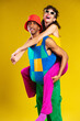 © BONNINSTUDIO/Stocksy - Couple in colorful clothes having fun