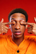 © BONNINSTUDIO/Stocksy - Black man covering eyes with manicured fingers