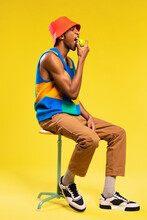 Man In Retro Clothes Eating Apple