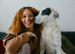 © Jimena Roquero/Stocksy - Pretty teenage girl posing with dog