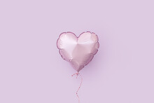 Violet Balloon Over The Same Color Background
