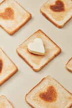 Closeup Of Toasts With Burnt And Butter Hearts