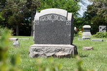 Blank Stone Monument In A Green Grassy Field, Close Up