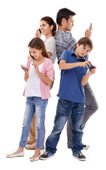  Enjoying their digital toys. Studio shot of four family members each using their own mobile phones.