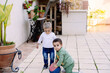 © Albert Martinez/Stocksy - Cute toddlers playing with ball together