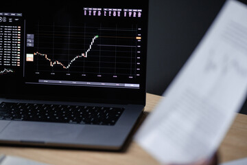 Illustration of stock charts on digital device 