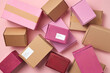 © Yaroslav Danylchenko/Stocksy - Pile of colorful delivery cardboard boxes
