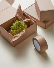 Box With Romanesco Broccoli Near Scotch Tape