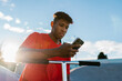 © Ezequiel Giménez/Stocksy - Colombian male teenager using smartphone in skate park