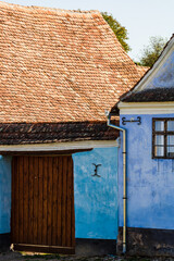 Wall Mural - View of picturesque village Viscri in Romania. Painted traditional old houses in medieval Saxon village of Viscri, Romania, 2021