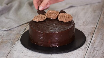 Wall Mural - Chocolate cake with chocolate glaze and cream, Prague.