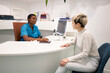 © Javier Díez/Stocksy - Doctor speaking with patient during appointment