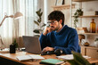 © BONNINSTUDIO/Stocksy - Thoughtful man working in home office