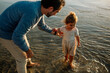 © Erin Brant/Stocksy - Father and young daughter wading in ocean