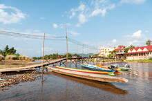 Laotian Colorful Fishing Boats In River Bank