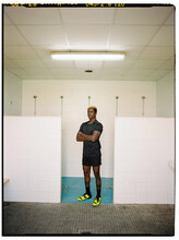 Black Male Footballer In Changing Room