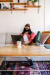 © Santi Nuñez/Stocksy - Positive freelancer at home