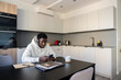 © Hernandez & Sorokina/Stocksy - Using Phone At Home