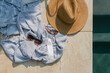 © Ali Harper/Stocksy - Towel and hat poolside
