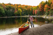 Cedar Strip Canoe Portage In Autumn