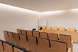 © Bisual Studio/Stocksy - Rows of seats in spacious meeting room