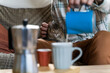 © Alba Vitta/Stocksy - Hygge moment with coffee and cat at home