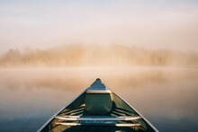 Canoeing On A Small Lake At Sunrise