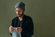 © Irina Polonina/Stocksy - Knitting crafty man.