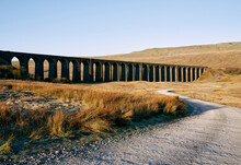 Sunlight Over Track Leading To Ribblehead Viaduct