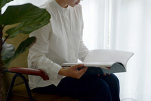 Closeup Of Asian Woman Reading Quietly