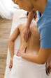 © STUDIO TAURUS/Stocksy - Masseuse working with client at spa