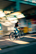 © Sergio Marcos/Stocksy - Unrecognizable woman riding her bike at high speed