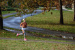 © Boris Jovanovic/Stocksy - Woman runing in park