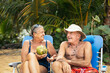 © Pedro Merino/Stocksy - Elderly couple having good time on the beach