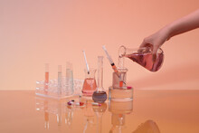 Scientific Researcher Or Doctor Pouring Chemical Substance Test Tube In Laboratory.