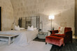 © VISUALSPECTRUM/Stocksy - Upscale Hotel Room in Old Monastery